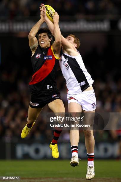 Angus Monfries of the Bombers marksinfront of Tom Lynch of the Saints during the round 18 AFL match between the Essendon Bombers and St Kilda Saints...