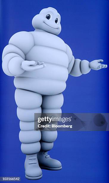 An image of the Michelin & Cie. "Michelin Man" character is seen at the company's news conference in Paris, France, on Friday, July 30, 2010....