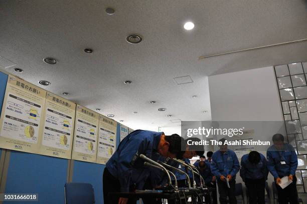 Hokkaido Electric Power Co executives attend a press conference at the company headquarters on September 11, 2018 in Sapporo, Hokkaido, Japan. A male...