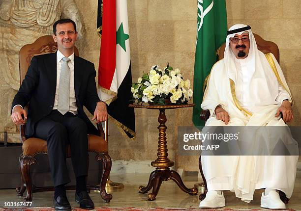 Syrian President Bashar al-Assad sits along side Saudi Arabia's King Abdullah and Lebanese President Michel Sleiman prior to their meeting at the...