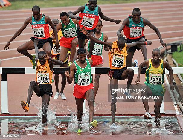 Uganda's Ben Siwa [1108], Ethiopia's Legeasa Lamisso Oyota [1542], Uganda's Benjamin Kiplagat [1099] and South Africa's Edwin Molepo [1278] run at...