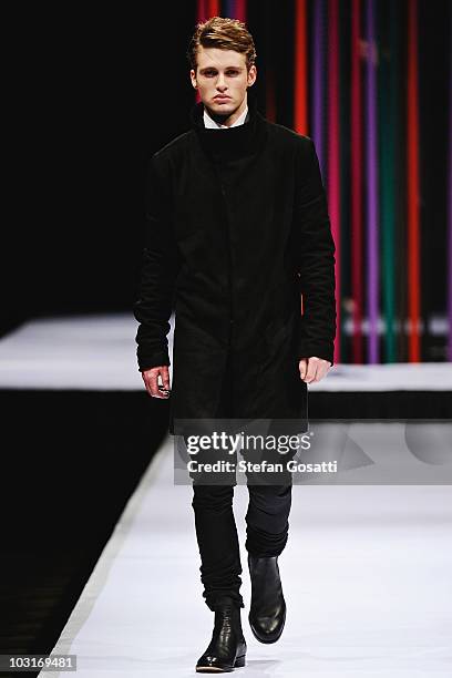 Model showcases a design by Arj Selvam on the catwalk during the StyleAid Perth Fashion Event 2010 at the Burswood Entertainment Complex on July 30,...