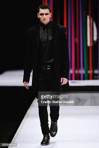 Model showcases a design by Arj Selvam on the catwalk during the StyleAid Perth Fashion Event 2010 at the Burswood Entertainment Complex on July 30,...