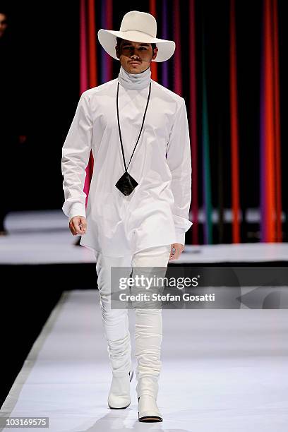 Model showcases a design by Arj Selvam on the catwalk during the StyleAid Perth Fashion Event 2010 at the Burswood Entertainment Complex on July 30,...