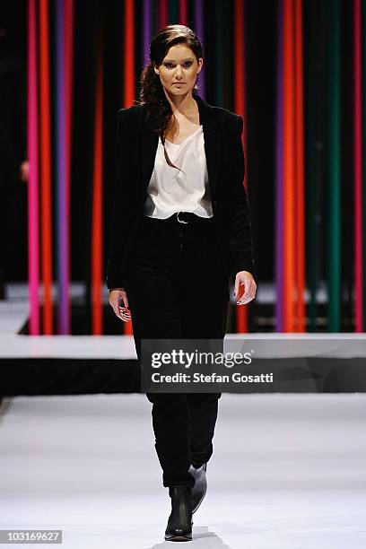 Model showcases a design by Arj Selvam on the catwalk during the StyleAid Perth Fashion Event 2010 at the Burswood Entertainment Complex on July 30,...