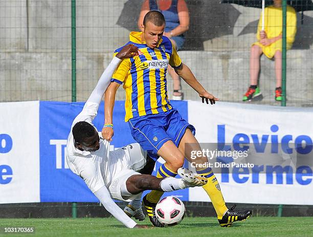 Mohammed Kasola maching penalty foul to Luca Antonelli of Parma during the pre-season friendly match between Parma and Al Sadd on July 30, 2010 in...