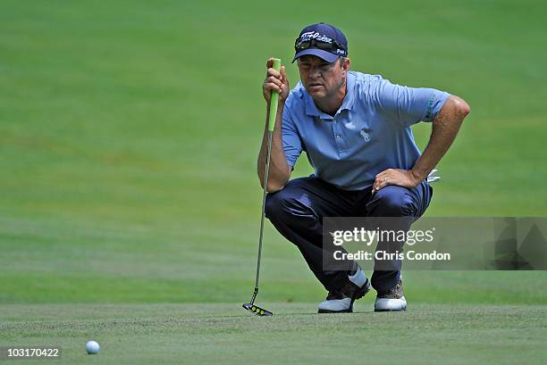 Davis Love III of USA lines up a birdie putt on during the second round of The Greenbrier Classic at The Greenbrier Resort on July 30, 2010 in White...