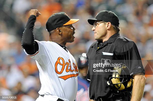 Interim Manager Juan Samuel of the Baltimore Orioles argues with Home plate umpire Bill Hohn during the seventh inning of the game against the...