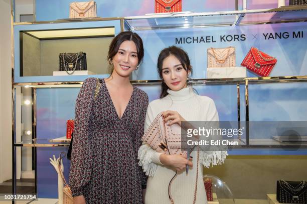 Carrie Wong and Yang Mi at the Michael Kors Rockefeller Center store on September 11, 2018 in New York City.