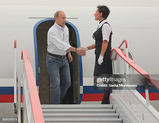 Russian Prime Minister Vladimir Putin arrives at an airport July 30, 2010 in Verkhnyaya Vereya, Russia. Putin visited the village where all 341 homes...