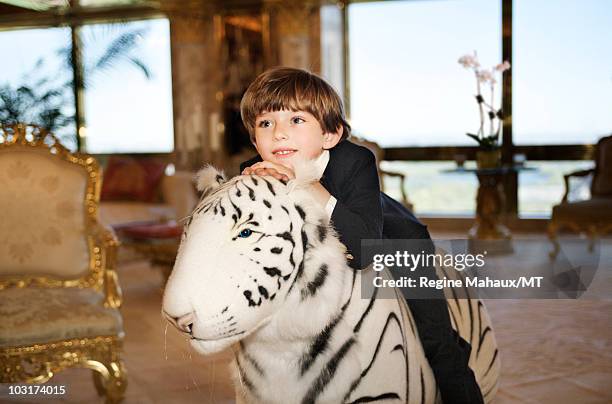 Barron Trump poses for a portrait on April 14, 2010 in New York City. Barron Trump is wearing pants and jacket by Papo d'Anjo, shirt by Leon and...