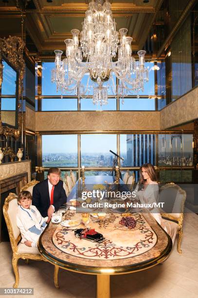 Donald Trump, Melania Trump and their son Barron Trump pose for a photo on April 14, 2010 in New York City. Donald Trump is wearing a suit and tie by...