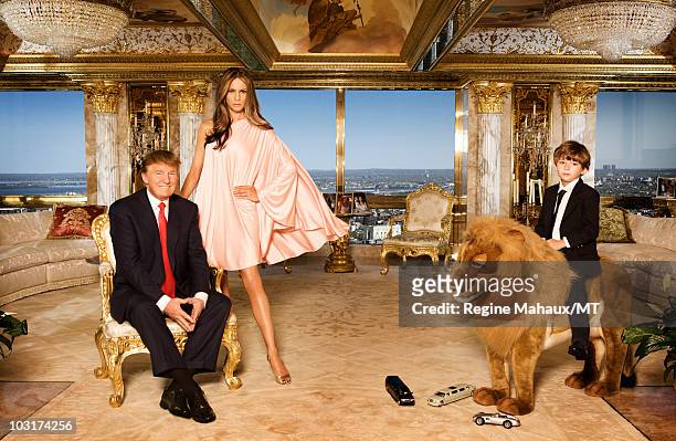 Donald Trump, Melania Trump and their son Barron Trump pose for a portrait on April 14, 2010 in New York City. Donald Trump is wearing a suit and tie...