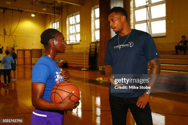 Lance Thomas ofthe New York Knicks participate in drills with students from University Heights High School during Laureus Day of Action on September...