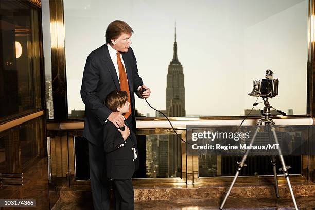 Donald Trump and Barron Trump pose for a portrait on April 14, 2010 in New York City. Donald Trump is wearing a suit and tie by Brioni, Barron Trump...