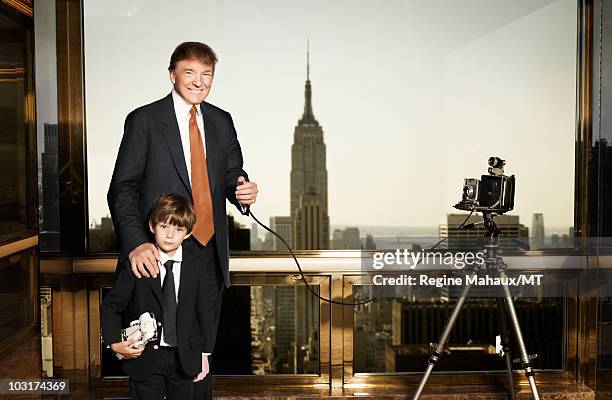 Donald Trump and Barron Trump pose for a portrait on April 14, 2010 in New York City. Donald Trump is wearing a suit and tie by Brioni, Barron Trump...