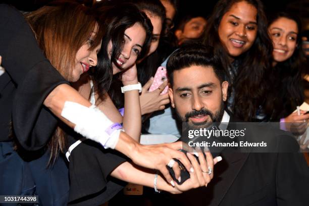 Abhishek Bachchan takes selfies with fans at the "Husband Material" premiere during 2018 Toronto International Film Festival at Roy Thomson Hall on...