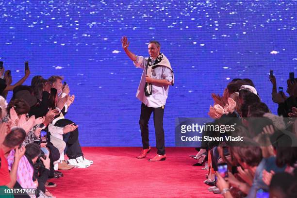 Designer Raf Simmons walks the runway for Calvin Klein Collection during New York Fashion Week at New York Stock Exchange on September 11, 2018 in...