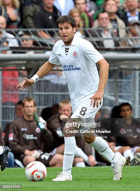 Florian Bruns of St. Pauli runs with the ball during the pre-season friendly match between FC St. Pauli and Racing Santander at Millerntor Stadium on...