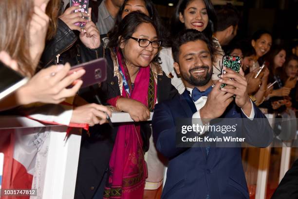 Vicky Kaushal takes selfies with fans at the "Husband Material" premiere during 2018 Toronto International Film Festival at Roy Thomson Hall on...