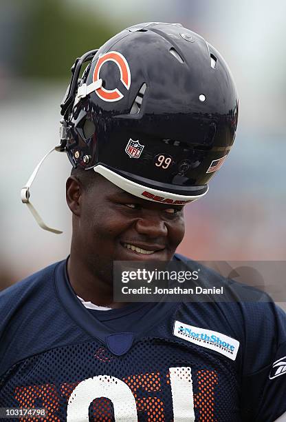 Tommy Harris of the Chicago Bears walks to a summer training camp practice at Olivet Nazarene University on July 30, 2010 in Bourbonnais, Illinois.