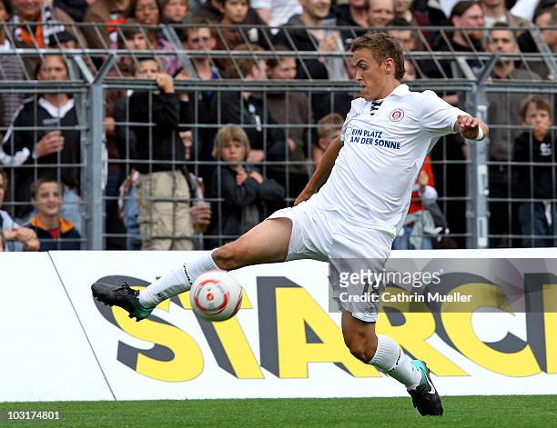 Max Kruse of St. Pauli runs with the ball during the pre-season friendly match between FC St. Pauli and Racing Santander at Millerntor Stadium on...