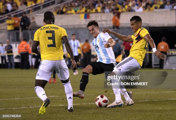 Argentina's midfielder Franco Cervi vies for the ball with Colombia's midfielder Deiver Machado during the international friendly match between...