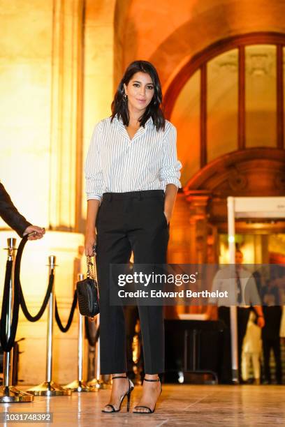 Actress Leila Bekhti is seen, outside the Longchamp 70th Anniversary Celebration at Opera Garnier on September 11, 2018 in Paris, France.