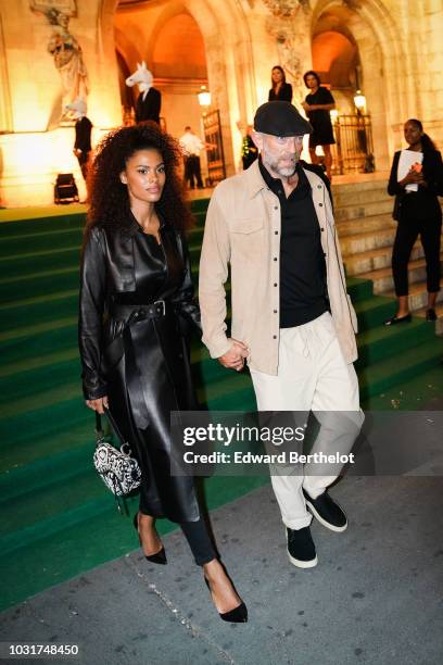 Tina Kunakey and Vincent Cassel are seen, outside the Longchamp 70th Anniversary Celebration at Opera Garnier on September 11, 2018 in Paris, France.