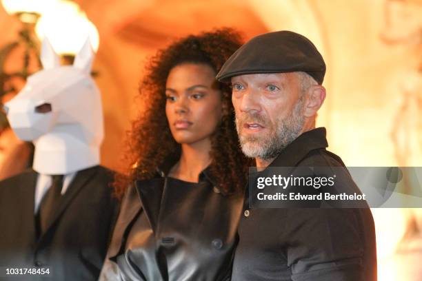 Tina Kunakey and Vincent Cassel are seen, outside the Longchamp 70th Anniversary Celebration at Opera Garnier on September 11, 2018 in Paris, France.