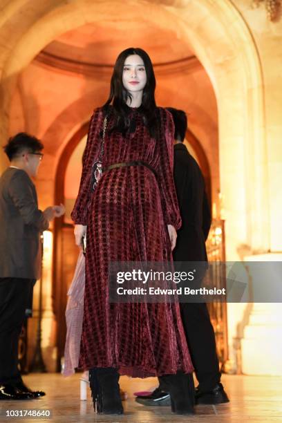 Teaoh Huwei is seen, outside the Longchamp 70th Anniversary Celebration at Opera Garnier on September 11, 2018 in Paris, France.