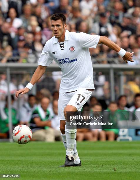 Fabian Boll of FC St. Pauli runs with the ball during the pre-season friendly match against Racing Santander at Millerntor Stadium on July 30, 2010...