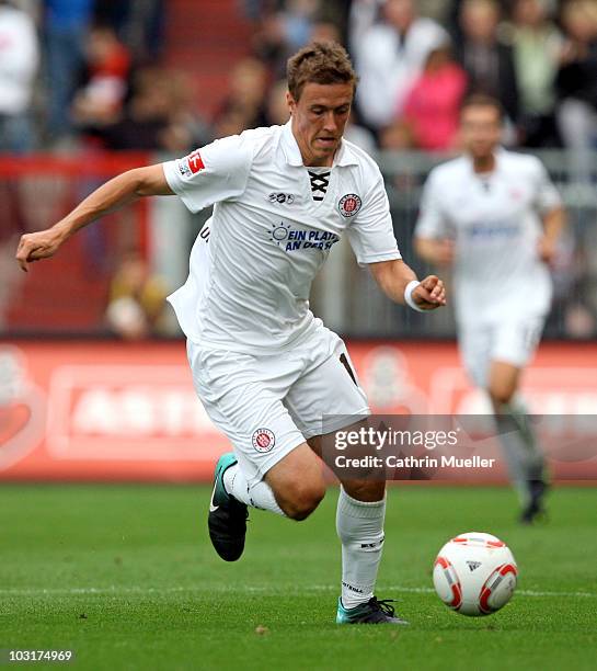 Max Kruse of FC St. Pauli runs with the ball during the pre-season friendly match against Racing Santander at Millerntor Stadium on July 30, 2010 in...