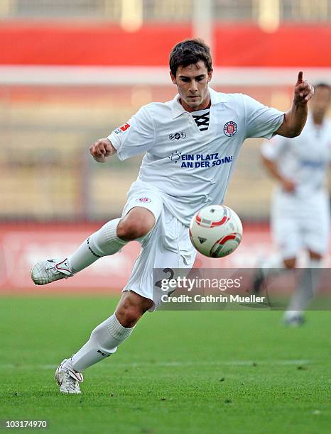 Fin Bartels of FC St. Pauli runs with the ball during the pre-season friendly match against Racing Santander at Millerntor Stadium on July 30, 2010...