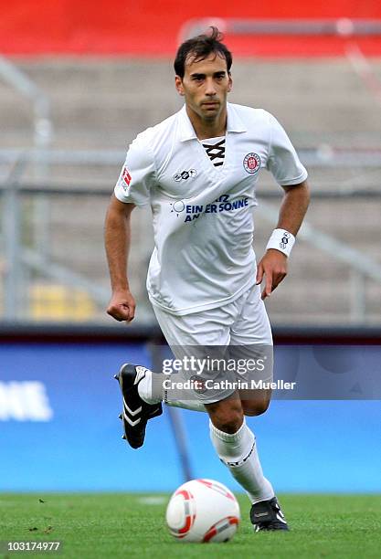 Fabio Morena of FC St. Pauli runs with the ball during the pre-season friendly match against Racing Santander at Millerntor Stadium on July 30, 2010...