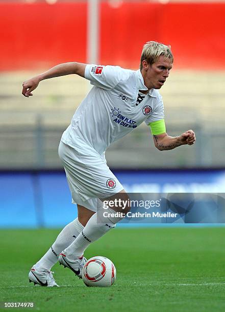 Marius Ebbers of FC St. Pauli runs with the ball during the pre-season friendly match against Racing Santander at Millerntor Stadium on July 30, 2010...