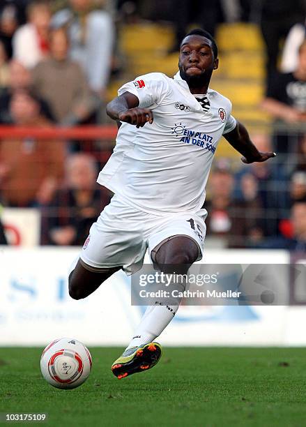 Richard Sukuta-Pasu of FC St. Pauli runs with the ball during the pre-season friendly match against Racing Santander at Millerntor Stadium on July...