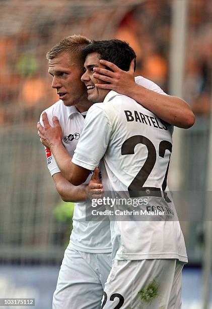 Rouwen Hennings of FC St. Pauli celebrates his goal with teammate Fin Bartels during the pre-season friendly match aginst Racing Santander at...