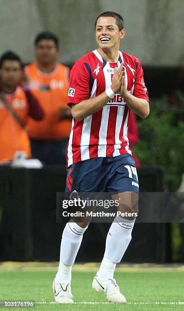 Javier "Chicharito" Hernandez of Manchester United, playing for his old team of Chivas Guadalajara in the first half, celebrates scoring Chivas'...