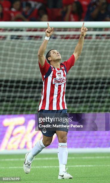Javier "Chicharito" Hernandez of Manchester United, playing for his old team of Chivas Guadalajara in the first half, celebrates scoring Chivas'...