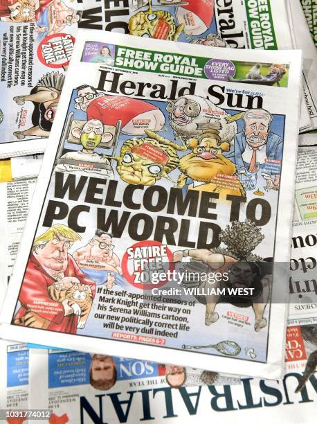 This photo illustration shows the front page of the Herald Sun newspaper, featuring a cartoon of US tennis player Serena Williams , on sale at a...