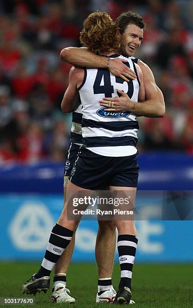 Cameron Ling and Cameron Mooney of the Cats celebrate a goal during the round 18 AFL match between the Sydney Swans and the Geelong Cats at ANZ...