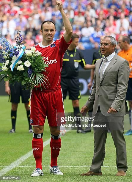 Head coach Felix Magath of Schalke says farewell to Heiko Westermann of Hamburg during the LIGA total! Cup 2010 match between FC Schalke 04 and...