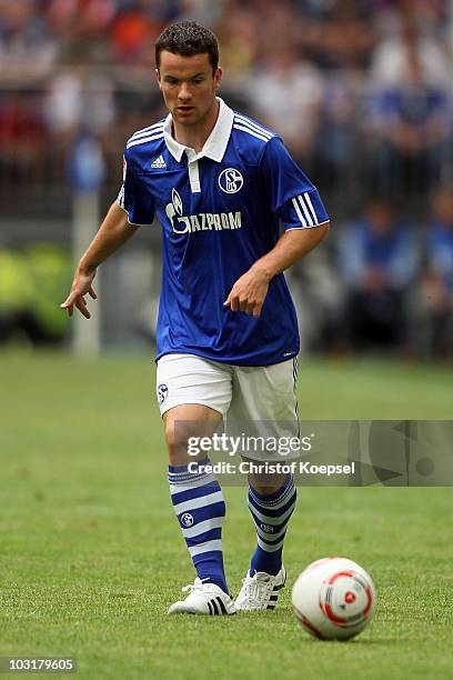 Alexander Baumjohann of Schalke runs with the ball during the LIGA total! Cup 2010 match between FC Schalke 04 and Hamburger SV at the Veltins Arena...