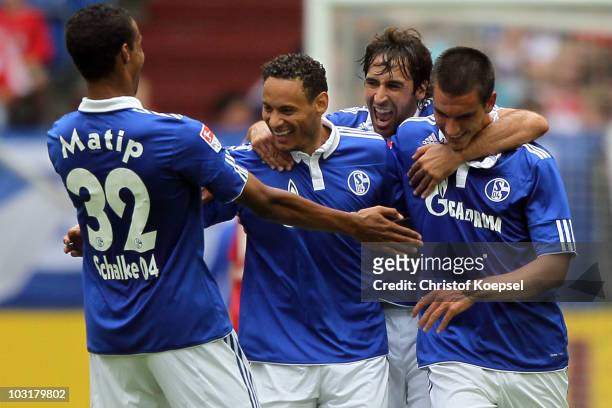 Jermaine Jones of Schalke celebrates the first goal with Joel Matip , Raul Gonzalez and Christoph Moritz during the LIGA total! Cup 2010 match...