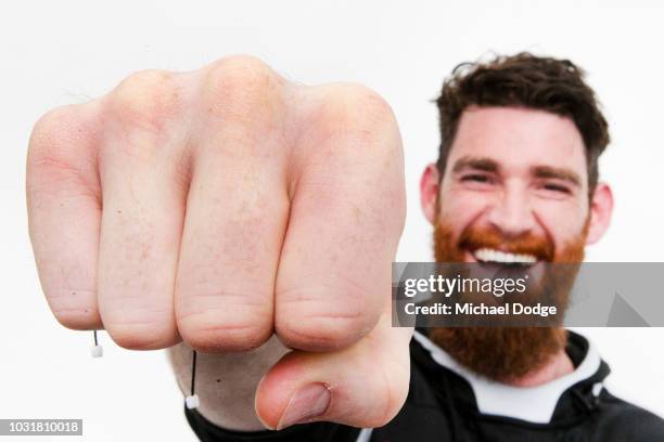 The big fist of defender Tyson Goldsack of Collingwood is seen as he poses during a Collingwood Magpies AFL media opportunity at the Holden Centre on...