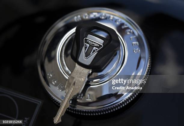 Photo shows the logo of Triumph on a motorcycle key in Ankara, Turkey on September 11, 2018.