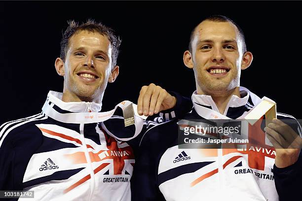 Rhys Williams of Great Britain receives the silver medal and David Greene of Great Britain receives the gold medal in the Mens 400m Hurdles during...