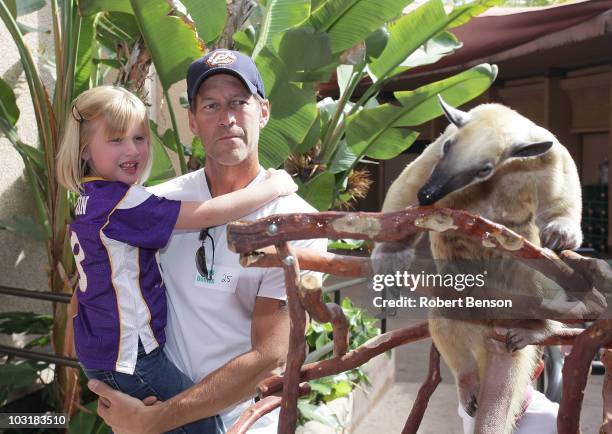 James Denton and his daughter Malin watch a lesser anteater on display at the San Diego Zoo on July 31, 2010 in San Diego, California. He and his...