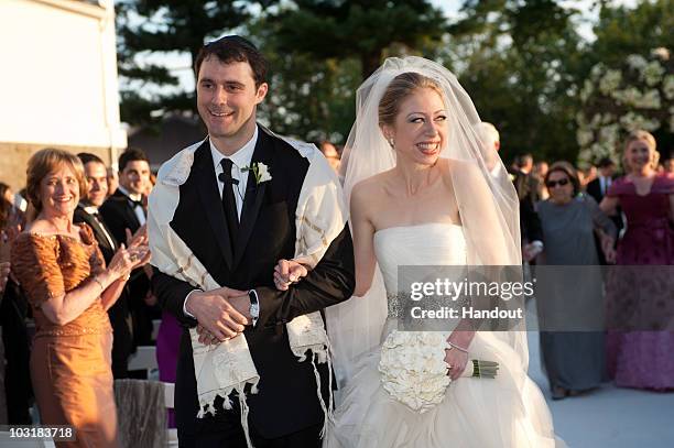 In this handout image provided by Genevieve de Manio, Chelsea Clinton weds Marc Mezvinsky at the Astor Courts Estate on July 31, 2010 in Rhinebeck,...
